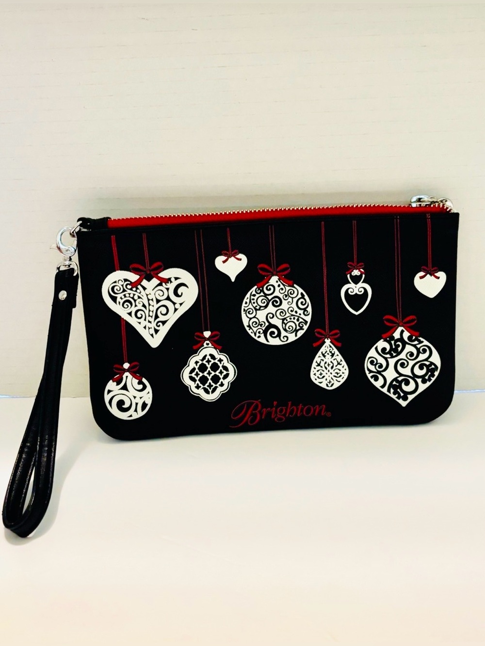 Brighton Black Wristlet Clutch with White Ornament Motif and Red Accents